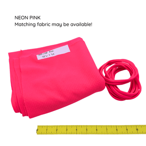 Neon pink baby headbands with matching piece of fabric.
