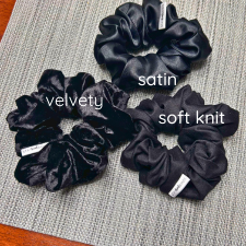 variety of black scrunchies in satin, soft knit and velvety