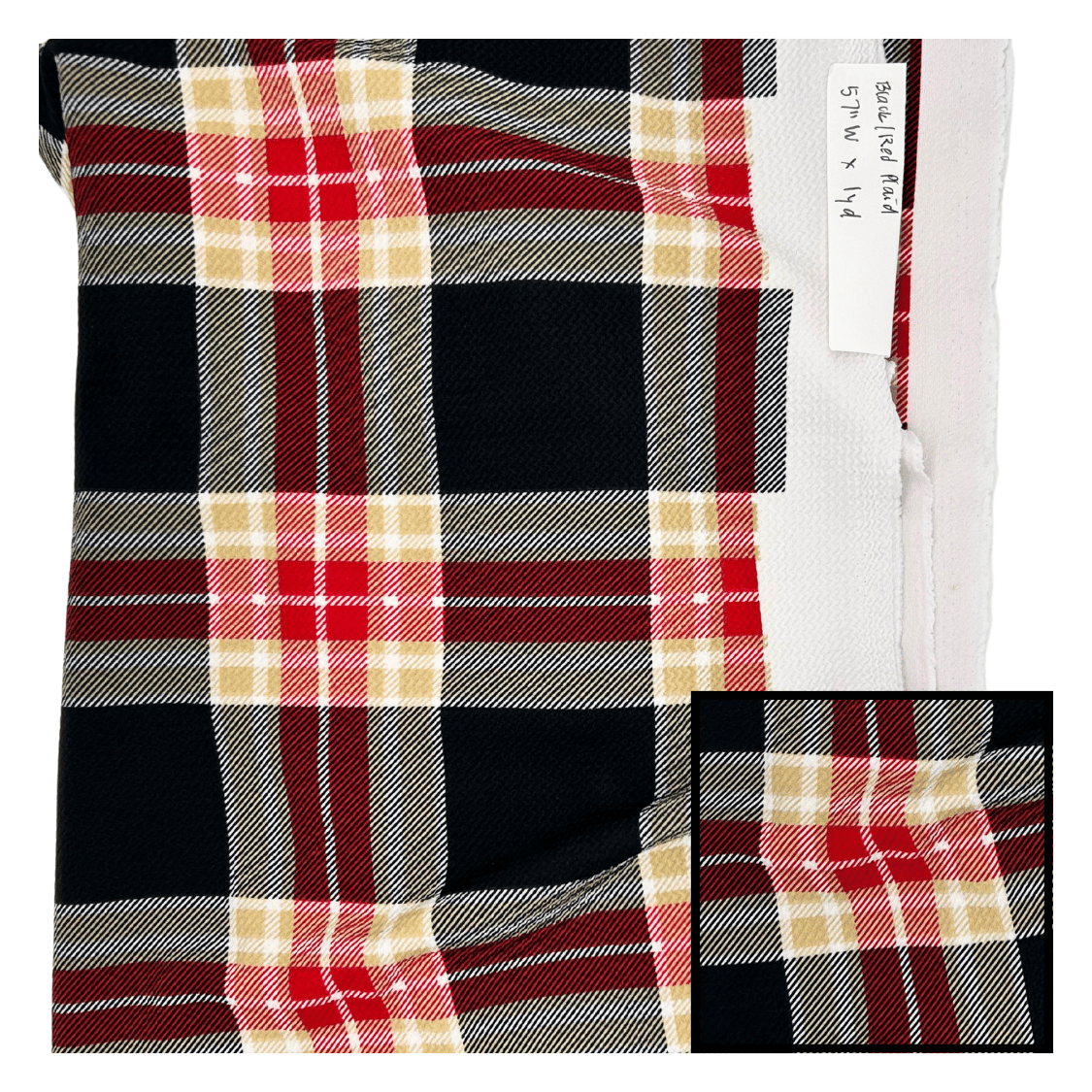 Plaid fabric with a close-up of a pocket and tag on a white background