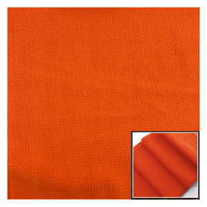 Solid orange fabric texture with a close-up inset showing texture details.