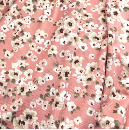 Pink or peach floral fabric swatch