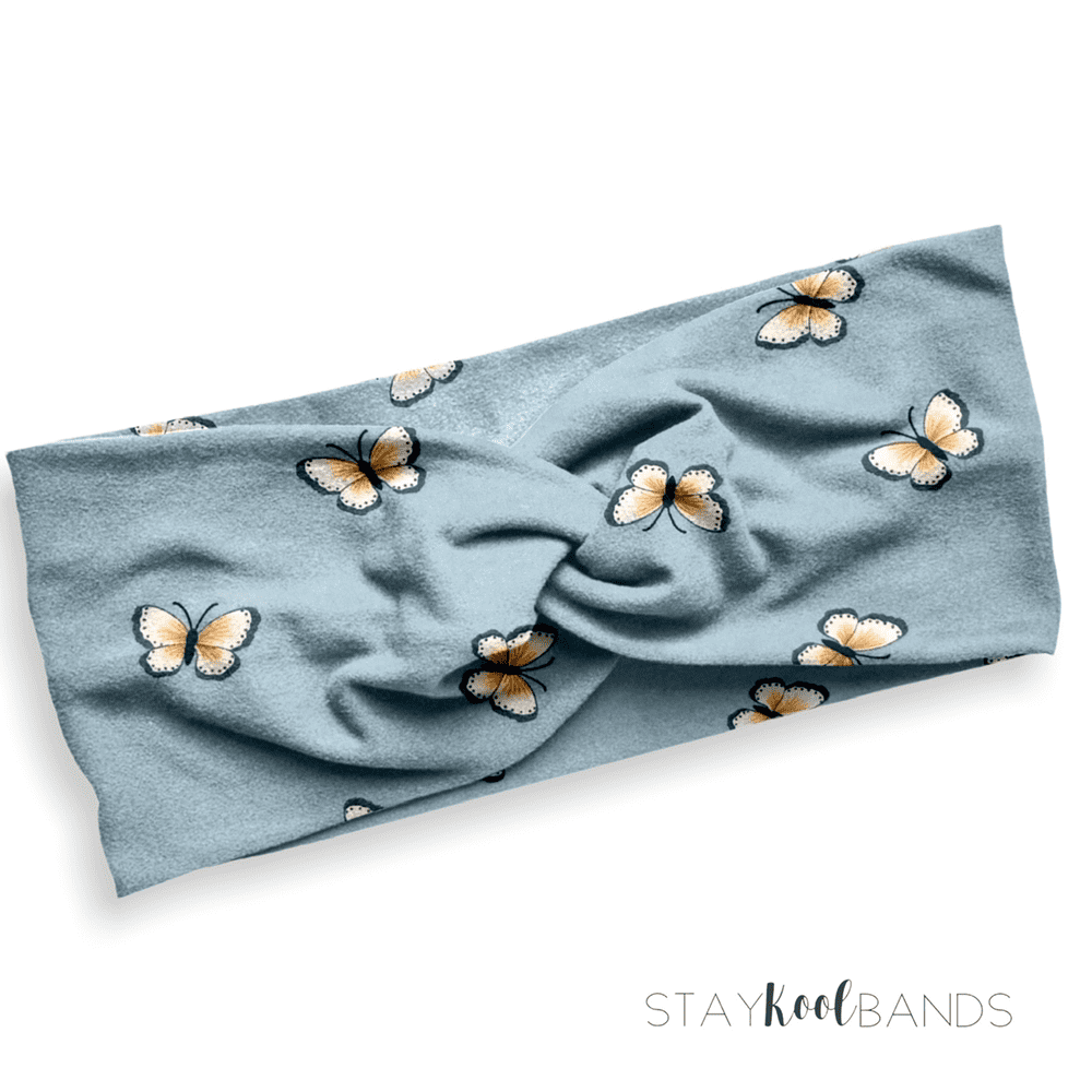 small butterflies on a soft blue stretch headband for adults