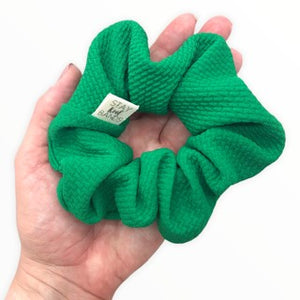 kelly green bullet scrunchie in hand