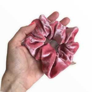 rose pink hair scrunchie in hand