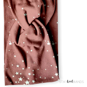 mauve with white stars on headband