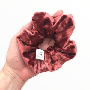 rust velour scrunchie in hand
