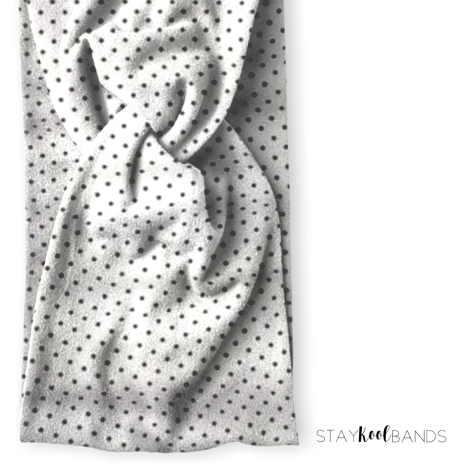 black polka dots on a twist headband